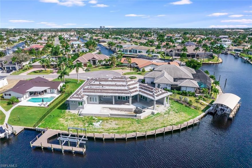 Town and River Estates new construction luxury waterfront home on one of the very best lots in Town and River! This prime gulf access location features 180 ft of water frontage, new seawall, 150 ft of new dock, 24k lb boat lift, sailboat turnaround basin, intersecting canal, longwater views greater than 450 ft in two directions, western exposure for sunsets, peaceful cul-de-sac, deep boating water, and safe traffic light access at McGregor Blvd. If you want a new home on the water in Fort Myers, this one will be move-in ready by February! Call now to find out if you can still make selections. A blueprint floor plan is provided in the photos where you will find 4 bedrooms, 3.5 baths, great room concept, 4 car garage, and a massive outdoor living area taking full advantage of this expansive backyard. Call now to learn how you can lock in the purchase of this specimen waterfront property prior to completion.