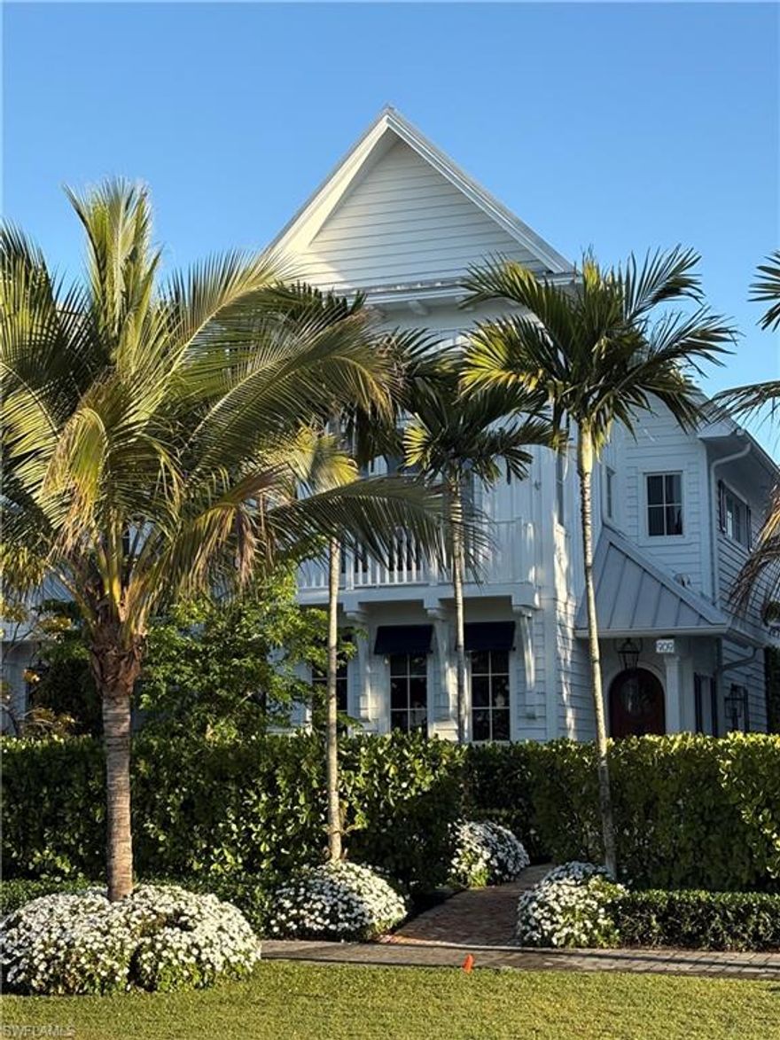 In the heart of Olde Naples, this 2020-built courtyard residence blends timeless coastal architecture with refined, resort-style living just moments from 3rd Street South and Naples’ pristine beaches. Shell-stone travertine floors introduce light-filled living and dining spaces designed for effortless entertaining. The chef’s kitchen is appointed with Sub-Zero refrigeration, Lacanche gas cooking, custom cabinetry, and a thoughtfully designed wet bar. A family room opens seamlessly to the private courtyard, creating true indoor-outdoor living. Upstairs, the serene primary suite offers volume ceilings, tailored millwork, and a spa-inspired bath, joined by two en-suite guest suites and a flexible den/office. A private elevator services both levels. The walled courtyard becomes a secluded retreat with heated plunge pool and spa, outdoor kitchen with built-in grill, surround sound, and lush vertical greenery for privacy. Impact-rated windows and doors, smart-home automation, natural gas, metal roof, and a generous two-car garage with storage complete this thoughtfully engineered residence. Beautifully scaled and impeccably maintained, 909 10th Avenue South offers the rare combination of walkability, architectural integrity, and lock-and-leave ease in Olde Naples.