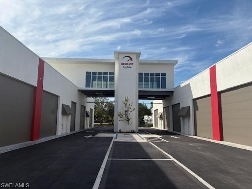 For Sale Unit 7. Redline Auto Suites is a distinguished automobile storage facility designed for owners who have a passion for the
car-culture lifestyle. The buildings are designed to reflect the attention to scale, proportion, and detail emblematic
of the prized automobiles contained within. The facility contains 18 private auto suites with approximately 1,000
square feet of floor area with an additional optional 330 square feet of loft space within the unit. The suites are
equipped with 16 ft. wide x 14 ft. high roll-up garage doors and laminated glass windows which are both Florida
Building Code compliant for hurricane wind pressures and large-missile impact for wind-borne debris. The
buildings are constructed with concrete block exterior and interior walls with a steel Purlin roof system. Individual
suites are shell spaces set up for a complete interior customization by the owner and contain standard utilities such
as a plumbed toilet room, HVAC system with an air-handler closet, and structural provisions for a mezzanine and
car lift racks. Redline offers an exclusive Club Room amenity which spans the entire auto court below inspired by a
motor speedway grandstand club suite.