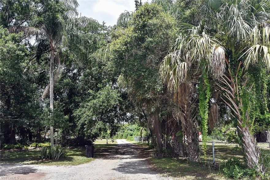 Are you looking for a little space in a country setting but yet minutes to shopping, restaurants, I-75 & US 41? This location cannot be beat! This beautifully maintained salt water pool home with 3 large bedrooms plus a den/home office, has had the same owner for over 42 years.  Imagine swimming in your spacious pool, having backyard BBQ's on your half acre property, space to store or work on projects, watch the numerous birds and wildlife and just enjoy nature and peace and quiet.  MANY recent updates include: Brand new hot water heater, newer range and refrigerator, new roof only 1 year ago, new AC in 2015, pool cage 2015 and clear hurricane shutters so you won't feel like you are living in a cave if you should need the shutters.
