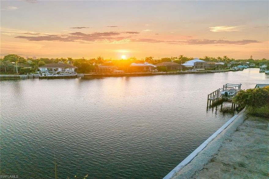 New seawall, southwest exposure and breathtaking wide-water views, this property has it all. Enjoy views, views, views of intersecting waterways and sunsets that fill the sky with color each evening. Positioned on a rare quarter-acre homesite with 100 feet of seawall, this lot captures sweeping long water views that showcase dolphins gliding by during the day and unforgettable sunsets each evening. Quick boating access to the Marco River and Gulf makes it a boater’s dream. This exceptional property offers an incredible opportunity to design and build your dream waterfront residence in one of Florida’s desired coastal communities. Enjoy the ultimate island lifestyle with nearby opportunities for boating, fishing, tennis, pickleball, paddleboarding, kayaking, beach yoga and membership at the prestigious Marco Island Yacht Club. Golf enthusiasts will appreciate the area’s championship courses, while the nearby executive airport ensures effortless travel. Create your paradise and experience the best of Marco Island coastal living.