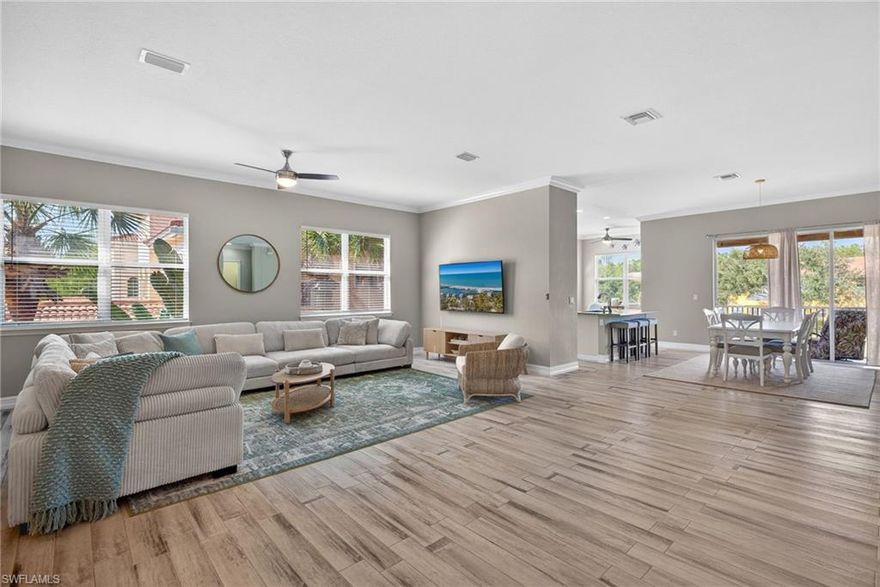 This light and bright second-floor carriage home is ready for you to start enjoying the Florida lifestyle. Inside, you’ll find an open living space with plank tile flooring, high ceilings, and crown molding that give the home an airy, welcoming feel. The kitchen features white raised-panel cabinetry, granite countertops and backsplash, and stainless steel appliances, including a sleek low-profile range. A cozy breakfast nook, surrounded by windows on three sides, is the perfect spot to start your day.   The spacious primary suite offers sliding doors to the lanai, a private bath with dual sinks, a separate tub and shower, and a generous walk-in closet. Guests will enjoy their own space with a comfortable second bedroom and nearby bath. The third bedroom, with French doors, easily doubles as a home office or den.  Step out onto the screened balcony and take in the peaceful lake views. Portofino’s convenient location puts you close to shopping, dining, ballparks, Six Mile Cypress Slough, and miles of biking and jogging trails—yet once you enter this Tuscan-inspired community, you’ll feel a true sense of calm and relaxation. Schedule your showing and come see why this feels like home.