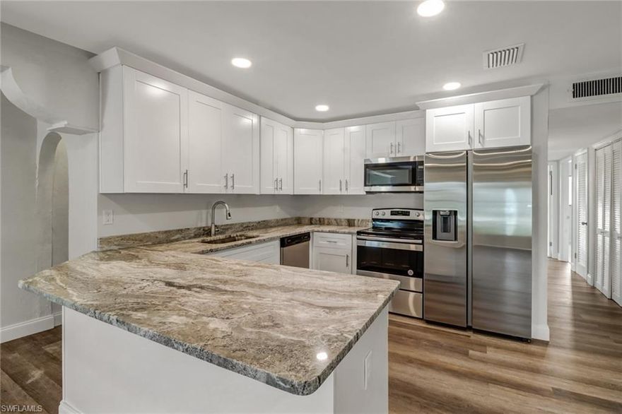 Welcome to this beautifully renovated 4-bedroom, 2-bath home offering 1,792 square feet of bright, open living space. The open floor plan is enhanced by luxury vinyl flooring throughout and a spacious Florida sunroom filled with natural light—perfect for relaxing or entertaining.

The updated kitchen features stylish shaker-style cabinetry, designer granite countertops, and top-of-the-line stainless steel appliances.  Both bathrooms have been tastefully renovated with new tile, and the primary bathroom includes sleek glass shower doors. Major upgrades include newer A/C and water heater, along with updated electrical throughout. Step outside to a screened-in in-ground pool and a fully fenced backyard with ample space for a shed or additional storage.

Additional highlights include a large circular driveway, two-car garage, dedicated laundry room, and workshop. Ideally located in the heart of Lehigh Acres, close to schools, shopping, supermarkets, and healthcare providers. Schedule your showing today.