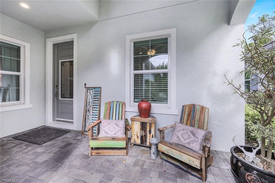 Discover the epitome of modern elegance in the Tidewinds model villa, crafted by Neal Communities in 2020. This stunning home boasts porcelain wood plank tile flooring throughout, creating a seamless flow from room to room. The well-appointed kitchen features a natural gas range and quartz countertops, perfect for culinary enthusiasts. The master bedroom offers a tranquil sanctuary with a walk-in shower and dual sinks, ensuring both luxury and convenience. Step outside onto the extended screen lanai and enjoy the serene view of the preserve, ideal for relaxation or entertaining guests. With its cute front porch, the villa exudes charm and welcoming appeal. Experience the convenience of fiber optic internet and the ease of lawn care, both included with the low HOA fees. The neighborhood itself offers a range of amenities, including a clubhouse with a pool, spa, grill, fire pit, and dog park. Located just minutes from downtown Naples and the pristine beaches, this villa presents a remarkable opportunity to embrace a sophisticated coastal lifestyle.