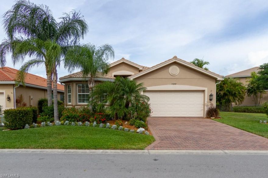 LIVING IS EASY IN THIS SPACIOUS HIGHLY SOUGHT AFTER "LILAC" MODEL! NEAR FORMER MODEL ROW AND LAST TO BE SOLD! With almost 2,200 square feet of living space, this 3 bedrooms plus Den / 3 Full Baths home makes for a perfect home, 2nd home or retirement home. Enjoy your screened in Lanai on this oversized lot. The entire main living areas of this home has tile on a diagonal for easy maintenance. Crown Molding Throughout. In addition, there are accordion hurricane shutters for your peace of mind. Gourmet Kitchen offers a breakfast bar, stainless steel appliances, granite counters and backsplash, under-mount lighting and 42" raised wood panel cabinets with pantry completes this space. At this price, this home will not last! Call now before it's gone! Botanica Lakes is one of SW Florida's most exciting real estate communities offering an incredible lifestyle and a great value, too! Botanica Lakes features over 100 acres of open space and natural preserves and 32 acres of lakes in a prime location off the Treeline Corridor. Botanica Lakes in SW FL truly has something for everyone. GORGEOUS LAKE VIEWS THAT YOU WILL WANT TO MAKE YOURS!