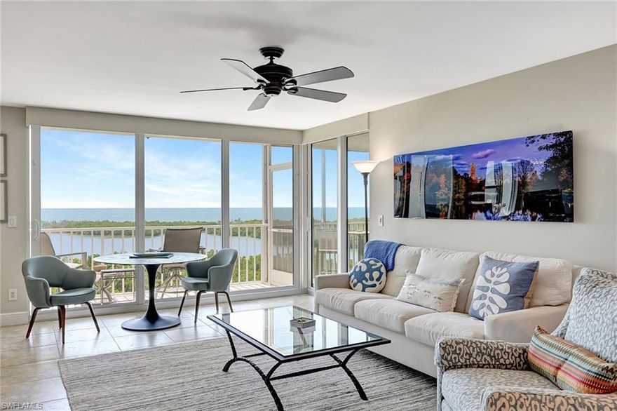 ANNUAL RENTAL now available. Nothing says "Naples" like Pelican Bay - especially St. Nicole with the beach shuttle at its back door! This 7th   floor beauty sits perfectly perched to enjoy a panoramic view over the Gulf of Mexico giving you a front row seat to Naples' spectacular sunsets.  Remodeled with all tile floors (no carpet) and an open kitchen, no detail was spared.  The den is outfitted with a built-in desk and multiple monitors for the ultimate "work-from-home" view.  The living area features multiple seating areas for both TV viewing and indoor or outdoor dining. The primary bedroom suite offers a king-sized bed, a mounted TV, and sliding glass doors that open to the screened portion of the lanai, and has an ensuite bath with a dressing area, two sinks, and a walk-in shower. The second bedroom has a Queen bed, its own mounted TV and a nearby bath with a shower/tub combination.  Enjoy the outdoors from either the open or screened portion of the lanai.  Want your toes in the sand instead?  Either walk or catch the community tram that picks you up right from your building, winding you down the boardwalk and through the mangroves to one of two private beaches - exclusive to Pelican Bay residents and their guests.  Building amenities include tropical pool & spa with BBQ grills, fitness facility, social room with kitchen, theater room, billiard room, guest suites, and secured building entry. St. Nicole is just a minute from upscale shopping, dining, and entertainment at Waterside Shops, Artis and Mercato. As a Pelican Bay guest, you will also have access to the community center, fitness & wellness studios, a very active tennis pavilion/pro shop, nature trails, fishing, sailing, canoe & kayaking which makes this a prime location for Naples rentals.  Did I mention the view?