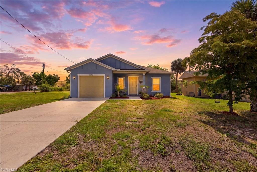 Photo of 2303 Ben ST S, FORT MYERS, FL 33916 (MLS # 226020760)
