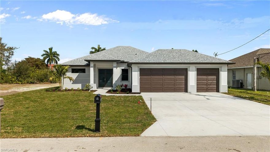 Recently completed!! This exceptional waterfront home sits on a 100-foot-wide canal just a few lots from Mohave Lake, providing quick access for boating, kayaking, fishing, and embracing the Florida lifestyle. ALL ASSESSMENTS have been PAID IN FULL. Built by Fairview Builders, a highly reputable Southwest Florida builder with over 30 years of experience, this quality-constructed residence offers 3 bedrooms, 2 bathrooms, a den, and a spacious 3-car garage with desirable southern rear exposure. The modern open floor plan features approximately 1,800 square feet of living area and a 652-square-foot garage. Step outside to a beautifully designed pool with a screened cage and brick paver decking, creating the perfect space for relaxation and entertaining. The interior showcases hurricane impact windows and doors throughout, tile flooring in every room, high ceilings with tray details, double front entry doors, and an 8-foot pocketing sliding glass door in the living room that opens seamlessly to the outdoor living area. The kitchen is appointed with High End Quartz countertops, a stainless steel appliance package, an oversized island, and real wood cabinetry. The primary suite offers dual vanities and a spacious custom walk-in shower. Constructed to meet the latest building codes, this home offers excellent energy efficiency and the potential for lower insurance costs. Best of all, it is NOT located in a flood zone, so flood insurance is not required. This is a rare opportunity to own a brand-new waterfront home in a prime location.