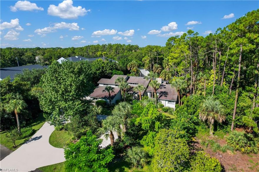 Custom built Estate Home in the highly sought after Oakes Estates neighborhood of Naples! A unique find on the canal front with 2.5 acres, detached 12-car garage w/ 7 commercial grade rv doors & 2 car lifts, custom built playground, racquetball court, gorgeous tropical landscaping, and custom cement walking path which covers the length of the property. This home features a professional gourmet kitchen w/ commercial grade appliances & design, living & family room layout w/ shared fireplace, rare Vinnaccia Stone flooring w/ real hardwood inlays, formal dining room, billiard room w/ pool table, 2 guest rooms on second floor along w/ a 3rd guest suite, and a massive lanai w/ long under truss sitting area. The custom mosaic tile pool speaks for itself. An absolutely fantastic location- easy access to I-75, only 30 minutes to Ave Maria, 10 minutes to the shopping & dining of MERCATO, less than half an hour from the beaches lining the Gulf of Mexico, and just 15 miles from the world famous Naples 5th Ave district.