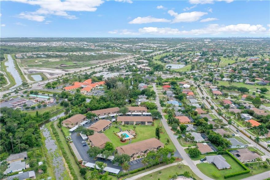 Completely renovated home w/ stylish cottage flair! Refreshing remodel from first step in -beadboard ceiling, beautiful tile flooring, tall baseboard, custom trim, industrial & contemporary light fixtures, Nantucket designed kitchen, plantation style bi-fold doors, Quartz countertop w/ full wall backsplash, gorgeous bathroom designs w/ frameless glass enclosed showers & stunning vanities. Lots of outdoor living space w/ a spacious open lanai at front entry and a huge screened rear lanai w/ storage area. This home is on the second floor and the building backs up to a wide canal surrounded by Old Florida landscaping giving it a peaceful & serene setting. Situated in a small non-gated deeded community that offers a community in pool in courtyard area and assigned covered parking. Abbington Village is inside the highly desired Lely Golf Estates w/ easy access to the heart of Naples and to Marco Island.