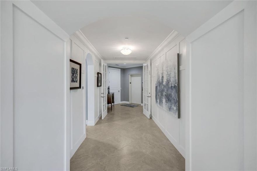 Carrara at Talis Park | Clive Daniel Designed Penthouse

Experience a residence that transcends the standard. This meticulously reimagined 3-bedroom plus den, 3.5-bath penthouse lives like a private estate, featuring a secure elevator entry that opens into a space defined by architectural depth and bespoke luxury.

Professionally curated by Clive Daniel Home, the interior reflects a sophisticated, modern aesthetic with extensive custom millwork, tray ceilings, and elegant tile flooring throughout the main living areas. The epicurean kitchen serves as the heart of the home, anchored by a Wolf gas range, a massive social island, and a light-drenched breakfast nook. Striking brushed bronze hardware and faucets provide a warm, contemporary contrast to the custom cabinetry, signaling a "no-expense-spared" philosophy.

The open-concept design flows seamlessly to an expansive wraparound screened lanai, offering a true indoor-outdoor sanctuary with sweeping, unobstructed views of the lake and championship golf course. The primary suite is a luxurious escape with a spa-like bath, while the versatile den and en-suite guest rooms provide total privacy for family or a home office.

Located just steps from the award-winning Vyne House, residents enjoy a resort-style pool, world-class fitness, spa, and an active sports program including tennis and pickleball. This residence offers the perfect blend of high-end design and the elite Talis Park lifestyle.