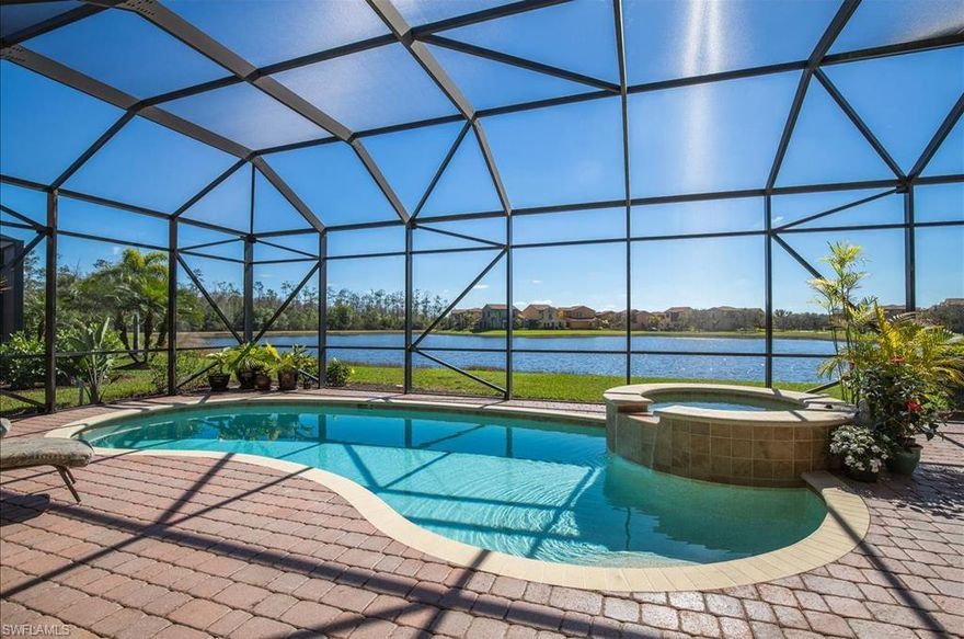 WOW!! What a Find! This former MODEL home for the developer is the Paseo property you must see before making any decisions!An absolutely gorgeous 3 +Den Pool Home with extraordinary PREMIUM SOUTHERN EXPOSURE LAKE VIEW!NEW HVAC 2017! New Refrigerator in 2018, HEATED Pool AND Spa with Aqua Link Control system! Surround Sound Speakers perfect for entertaining! MANY well thought out upgrades to enjoy!  PASEO VOTED COMMUNITY OF THE YEAR 9 YEARS IN A ROW!! Come relax by the RESORT STYLE POOL or enjoy a beverage at the TIKI bar. Watch a game at the PUB or enjoy brunch at the BISTRO. Grab a friend and catch a movie in the cinema.Looking for a workout, how about the FULLY EQUIPPED GYM or a game of doubles on one of the 6 har tru TENNIS COURTS or PICKLEBALL courts if you prefer. Perhaps enjoy a day tranquility with a HOT STONE MASSAGE AT PASEO SPA! You won't run out of things to do! Make sure you see Paseo before you buy. EASY TO SHOW! Book today and you will not be disappointed in seeing this home waiting for you in sunny Southwest Florida! Close to Shopping, RSW Airport,Many schools, and TONS of restaurants! See why so many call this community paradise! Truly a one of a kind development!!