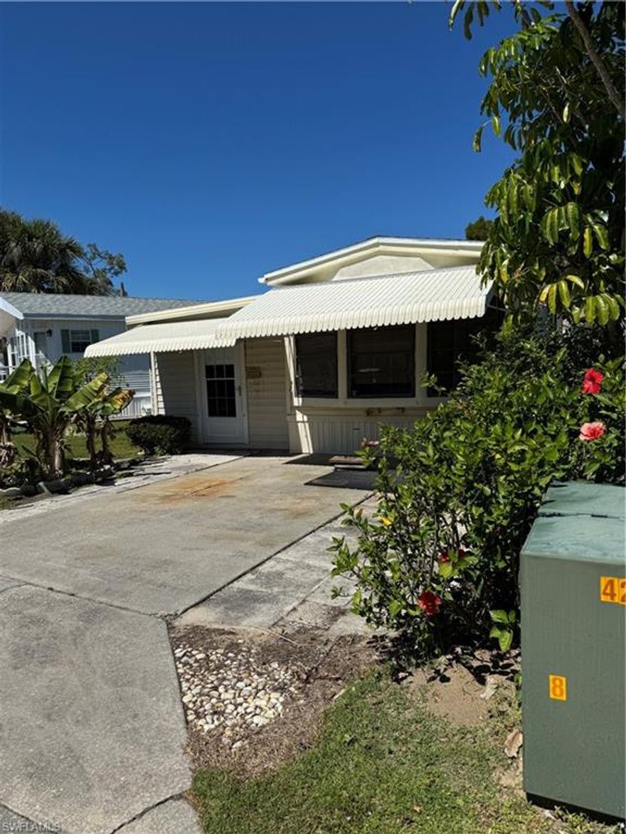 WELCOME TO Fabulous Florida Living in Corkscrew Woodlands! This property is ready for its new owner to make it YOUR own and priced to sell! Spacious side yard on this lot with plenty of space for outdoor hobbies!! Enjoy your new home, boasting with tropical landscaping and banana trees.  Just steps from the community center, yet plenty of enjoyment in the quiet peaceful Woodlands.
This 55+ Gated community is conveniently situated on 123 Acres of land in the heart of Estero. Enjoy the lakefront lap pool, hot tub, and more.  Enjoy wildlife on the miles of nature trails, bridges and canals, including a butterfly garden. HOA fees of $717/quarter includes Water, Sewer, Basic Cable and Lawn maintenance! Your property is deeded to you, meaning your Land in this 55+ community is OWNED, no lot rent which means  there are no expensive monthly land lease fees. ! Enjoy the benefits of RECENTLY REPLACED AC, ensuring year-round comfort. Conveniently situated near shopping, great restaurants, superb entertainment, RSW airport, and beautiful beaches, this home offers unbeatable convenience. The community amenities are abundant, featuring a refreshing pool, relaxing spa, fun mini golf, a welcoming clubhouse, and numerous activities including pickle-ball and tennis. Nestled in one of the most desirable locations in the Southwest Florida areas, this property is a fantastic opportunity for those looking for a snowbird season or full time home. Don't miss out on this gem!  Discover the charm of Corkscrew Woodlands, where you'll find a welcoming, vibrant community and an ideal location to call home. With easy access to I-75, and US-41 commuting to Fort Myers, Coconut Point, Bonita Springs and Naples is a breeze. Whether you choose to bring your RV and park it here, rent to someone else, or establish a permanent manufactured home, this space is ready for YOU, its new owner! Corkscrew Woodlands is an active 55+ community perfectly suited for both full-time living and seasonal getaways. Enjoy a plethora of amenities, including pickleball, tennis, bocce ball, horseshoes, shuffleboard, mini-golf, golf cart and biking trails, as well as fishing and paddling opportunities. The large clubhouse, pool and spa, gym, potlucks, and countless activities ensure there’s never a dull moment! Don't miss out on this exceptional opportunity!