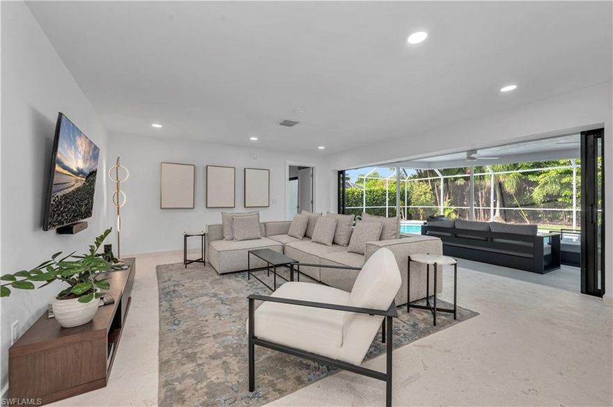 Nestled in the heart of Park Shore, this beautiful home sits on an oversized corner lot with a circular driveway, surrounded by captivating homes on a quiet street. Inside, you’ll find a fully renovated, modern space with 4 bedrooms and 3 full bathrooms. It’s a quick walk to Venetian Village or Park Shore’s private beach. The home features thoughtful upgrades throughout, including limestone flooring, a well-designed kitchen with quartzite countertops, Bosch appliances, and a custom pantry. A dry bar with two drink fridges adds extra convenience for entertaining. All bathrooms have been completely updated with clean, modern finishes. Recent improvements include a new HVAC system, water heater, pool equipment, epoxied garage floor, garage door opener, washer and dryer, and all kitchen appliances. Custom closets throughout provide plenty of storage. The primary bedroom includes a standout custom design, while the spacious, rescreened lanai and newly resurfaced saltwater pool create a great space to relax or entertain. An outdoor kitchen area completes this move-in-ready home.