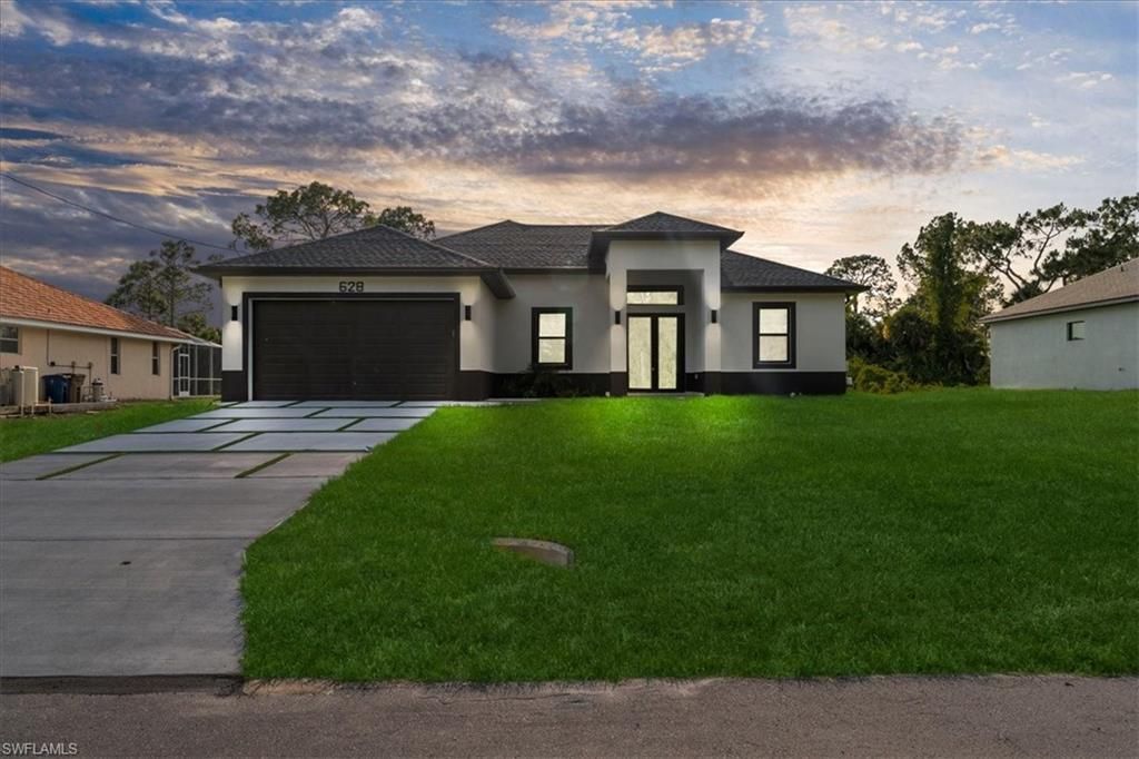 Photo of 628 Beach AVE S, LEHIGH ACRES, FL 33974 (MLS # 226017118)