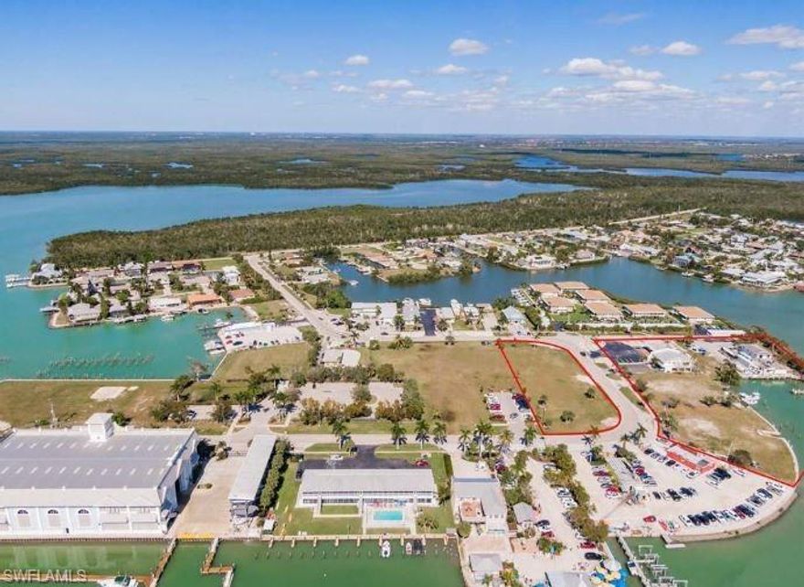 Rarely available commercial property on Isles of Capri. Includes 8 parcels - waterfront lots Lots, 285, 287, 289, 298, 296, 294 .69 lot acres total