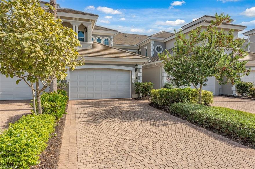 Enjoy peaceful eastern exposure and serene lake views from this spacious three-bedroom plus den, three-bath end-unit residence in the desirable Varenna neighborhood of Fiddler’s Creek. With a generous 3,029 square feet of living space, a two-car garage, impact windows, and the ability to add an elevator, this beautifully maintained second-floor coach home, quality-built by Gulf Bay, offers exceptional comfort, privacy, and livability. A pavered driveway and new tile roof enhance the exterior, while a large screened-in lanai overlooking the lake provides an inviting space for sunrises, morning light, outdoor dining, and relaxation, complete with porcelain tile flooring, two ceiling fans, roll-down shades, shutters for slider protection, and an electric cooktop/griddle with stainless steel hood. Inside, a spacious foyer with two walk-in closets introduces the bright, open interior, where diagonal-set tile flooring, crown molding, and window coverings enhance the main living areas. The kitchen features quality Raffinati Italian cabinetry, granite countertops, and GE Profile appliances, including a natural gas range, along with both a breakfast bar and an eat-in nook with bay windows. Adjacent to the kitchen, the family room offers a comfortable gathering space with direct access to the lanai. The living room also opens to the lanai and includes a formal dining area along with a free-standing bar and entertainment area, creating an elegant and flexible setting for everyday living and entertaining while highlighting the tranquil lake views. The owner’s suite offers two walk-in closets and sliders opening to the lanai. Its spacious bathroom includes dual vanities, a soaking tub, and a walk-in shower with a glass enclosure. The front guest bedroom includes a private balcony on the west side of the home to enjoy sunsets, and an en-suite bathroom with a walk-in shower. The second guest bedroom offers an en-suite bathroom featuring a shower-tub combination that is also accessible from the hallway for added convenience. A den with double doors serves as an ideal home office, study, or flexible retreat. Additional highlights include wood stairs, an alarm system, a well-equipped laundry room with storage and a utility sink, and a two-car garage with a painted floor and a tankless gas water heater. Residents enjoy an award-winning gated community enriched by newly completed 2025 enhancements, including an updated resort-style pool area with waterfalls and slides, an enhanced Gator Grille restaurant, and ten new pickleball courts. The clubhouse anchors exceptional amenities such as a world-class fitness center, six Har-Tru tennis courts, a hot tub, sauna, steam room, and outstanding indoor and outdoor dining. Optional memberships, with no waitlist for golf, offer access to the renovated golf course, new golf clubhouse, marina, and private beach club, creating a true resort-style experience in one of Naples’ most desirable communities.