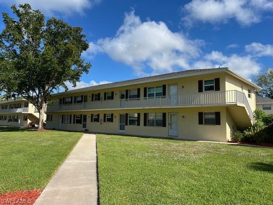 **Attention Investors or Homebuyers!** This 2BR/1BA second floor end unit is PRICED TO SELL!! Updates include new AC (2024) impact windows (2023), plumbing and water heater (2022.) Impact windows give owners peace of mind during storm season while also reducing outside noise and lowering electric bills. Other features include neutral tile throughout, white cabinets and an updated, stylish bathroom. Sewer, water and trash removal are included in the HOA fees.  Residents also enjoy the convenience of on site laundry facilities, extra storage, a large community pool and beautifully landscaped grounds.  Three leases per year (30 day minimum) are permitted making it a great investment opportunity. Poinciana is centrally located - close to beaches, shopping, dining, parks, downtown Naples, Bayshore Arts District, I 75, and RSW airport. It is even walking distance to Poinciana Elementary School. Don't wait - this gem won't last!