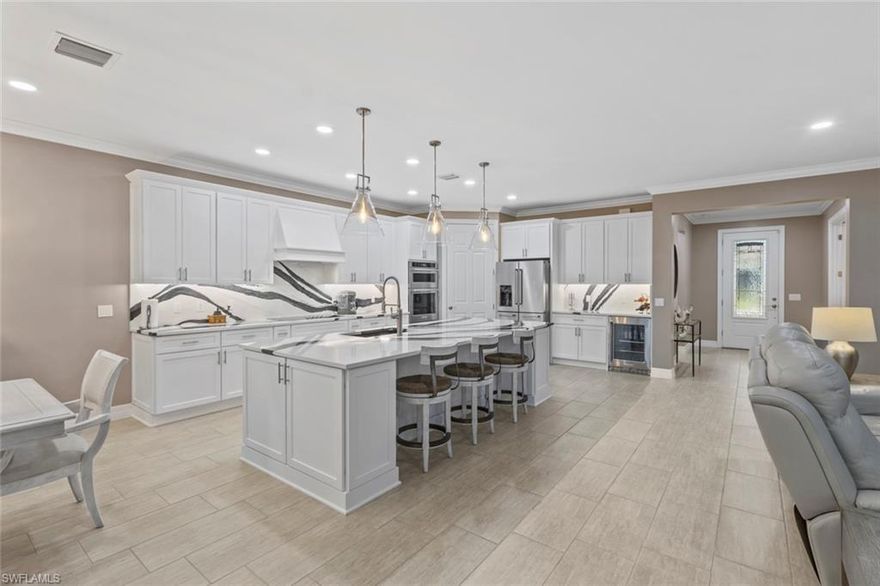 Experience true FLORIDA LUXURY LIVING with a LARGE SALTWATER HEATED POOL and SPA in this beautifully upgraded home, perfectly positioned on a quiet cul-de-sac in the 55+ Del Webb Naples community. Better than new construction, this enhanced PINNACLE floor plan (similar to the STELLAR) delivers the elevated lifestyle today’s buyers are searching for.

This 3-bedroom, 3-bath plus den home showcases REMODELED KITCHEN AND BATHROOMS with all NEW Cabinets, PLANTATION SHUTTERS, DESIGNER LIGHTING, upgraded ceiling fans, and fresh interior and exterior paint for a crisp, modern look.

The PRIMARY SUITE is a luxurious retreat, offering an extended walk-in shower and dual sinks. The CHEF’S KITCHEN is completely refreshed with BRAND NEW quartz countertops, upgraded appliances, BEVERAGE CENTER, a new sink and faucet, and thoughtfully designed for seamless entertaining.

Additional upgrades include IMPACT GLASS WINDOWS, floor-to-ceiling tile in the bathrooms, extra recessed lighting, and TILE FLOORING throughout. 

Step outside to your private oasis - an expansive screened-in lanai featuring a SALTWATER POOL and SPA, super screens, and accented by elegant marble pavers. Enhanced landscaping provides added privacy around the pool area. Storm Smart ELECTRIC HURRICANE SCREEN on the lanai keeps your furniture clean and dry during storms.

The oversized 4’ EXTENDED GARAGE includes epoxy flooring and overhead storage, providing ample space for a golf cart, workshop, or additional storage needs. You will have a piece of mind with a whole house portable 13,000 kw GENERATOR. 

This home comes with the SOCIAL MEMBERSHIP, but take note GOLF LOVERS,  Panther Run Golf Club offers optional MEMBERSHIPS with premium golf experiences just steps from your backyard.
In Del Webb Naples, you’ll enjoy WORLD-CLASS AMENITIES that rival luxury resorts: dine at the Rusty Putter Restaurant, soak in the RESORT-STYLE or LAP POOLS, break a sweat in the state-of-the-art FITNESS CENTER, and play your way through PICKLEBALL, TENNIS, bocce, billiards - even a top-tier GOLF SIMULATOR!
Need groceries, church, or a bite to eat? Just hop in your golf cart and cruise into town - Publix and the heart of Ave Maria are just minutes away.
This isn’t just a home - it’s a LIFESTYLE UPGRADE in one of Southwest Florida’s most vibrant 55+ communities. Don’t miss your chance to live where fun, fitness, and friendships flourish year-round!