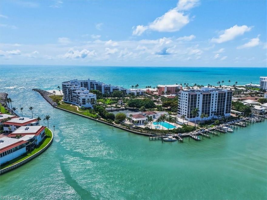 Waterfront Luxury Living at Admiralty Point! Welcome to Unit 604 at 2400 Gulf Shore Blvd N — a stunning 2-bedroom, 2-bathroom condo offering 1,650 square feet of refined coastal living with breathtaking direct views of Moorings Bay. Every room in this thoughtfully updated residence frames the sparkling waters of the bay, from the spacious living and dining areas to both bedrooms. The expansive tiled lanai is a true showstopper, offering generous space for dining, lounging, and watching dolphins play along nearby Doctors Pass. Spring brings magical manatee sightings right from your private vantage point, while gorgeous Gulf sunsets paint the sky each evening. Recent upgrades elevate this home with new quartz countertops, professionally painted cabinetry, GE Profile appliances, impact windows, and fresh LED lighting throughout the kitchen. The primary bathroom features dual sinks with a separate shower and tub, while elegant crown molding graces the main living spaces and bedrooms. A key investment advantage: a reliable six-month seasonal tenant returns annually from November through May, providing dependable rental income. Admiralty Point delivers true country club living with resort-caliber amenities — boat docks, kayak launch, Gulf beach access with clubhouse and pool, Har-tru tennis courts, bocce, shuffleboard, a large fitness center, and a vibrant social calendar featuring Thursday cocktail parties, monthly events, book clubs, and lecture series. The location is unmatched. The Village Shops on Venetian Bay sits just up the street for upscale shopping and waterfront dining. World-famous 5th Avenue South and the iconic Naples Pier are minutes away, while Waterside Shops and Mercato offer additional premier retail and entertainment destinations. This is more than a condo — it's a lifestyle defined by water views, warm community, and the very best of Naples living.