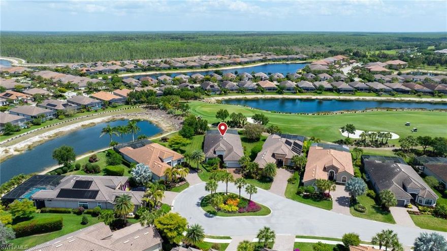 FULL GOLF MEMBERSHIP INCLUDED! A LOT to Love! This highly sought after “Palazzio” model is situated on a premium oversized (nearly half an acre/.39) pie shaped lot at the end of a quiet cul-de-sac street with expansive views of two lakes and the 14th green. 

The spacious floorplan features 3 Bedrooms plus Den, 3 full bathrooms, and nearly 3,100 sq ft of air conditioned living space accompanied by an oversized 550 sq ft covered lanai. With oversized rooms throughout, the open great room floorplan creates a seamless flow for entertaining and comfortable living. Two sets of pocketing sliding glass doors invite you to the expanded lanai, where you can enjoy picturesque lake and golf course views, making this outdoor space an absolute retreat. The private pool area boasts a gas-heated pool with two waterfalls. For those who love outdoor living, the lanai is equipped with an outdoor kitchen and can be enclosed by electric motorized roll-down hurricane screens, ensuring year-round enjoyment. Inside, oversized 24”x24” porcelain tile floors flow throughout the common areas. The expanded kitchen features an abundance of raised-panel cabinetry, Cambria quartz countertops, a stylish tile backsplash, and top-of-the-line GE Café appliances, including a GAS range. Additional luxury finishes include: impact glass double front doors with matching sidelights; tandem style 3 car garage; expanded front guest bedroom with bay window; built-in cabinetry and desk in the den; special order lights/chandeliers; crown molding throughout; tankless GAS hot water heater; and more! This home is being offered FULLY FURNISHED so one can start enjoying the Esplanade lifestyle immediately without any inconvenience!

Esplanade Golf & Country Club of North Naples offers a true “Lifestyle Community” with world-class amenities, including a resort pool with cabanas and the popular “Bahama Bar,” tennis, pickleball, bocce, a 14-mile network of bike/walking trails, and an 18-hole private golf course. The impressive 15,000 Sq Ft clubhouse features a restaurant, bar, wine-tasting room, wine lockers, and a Starbucks-style café. Best of all, the property’s landscaping, irrigation, golf membership, and all community amenities are covered under a quarterly fee of just $3,768—no additional fees or memberships required! Don't miss your opportunity to own this exceptional home in one of Naples’ most sought-after communities. Schedule your tour of this stunning home and Esplanade Golf & Country Club today! NON FLOOD ZONE/NO FLOOD INSURANCE REQUIRED/ZONE X!