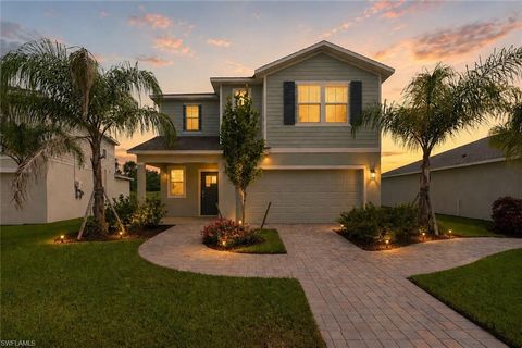 Photo of 12431 Amber Waves RD, LEHIGH ACRES, FL 33974 (MLS # 226023646)