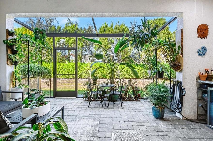 Modern elegance in the heart of Naples!  3 bedroom/2½ bath, two-story townhouse with one-car attached garage has upgrades galore!  This Banyan plan offers a chef's kitchen with modern wood cabinetry, granite counters and backsplash, induction cooktop, Kitchen Aid wall oven/microwave convection combo, pot filler, wine cooler and Water Drop water filtration system.  The counter-height island provides an abundance of bar seating and adjoins the spacious dining area with custom lighting and great room complete with beautiful shiplap feature wall.  Such care in design throughout the home...even the first-floor powder room was not forgotten, as it features a custom tile splash wall behind the classic pedestal sink.  The extended lanai provides a grilling nook with granite counters and private landscaped view.  Upstairs, you will find all 3 bedrooms and a versatile loft area perfect for a home office, reading nook or play room.  The oversized primary suite is fantastic with stylish lighting, dual closets, dual sinks, stand-alone soaking tub with laser-cut Carrera tile accent wall and enlarged walk-in shower.  Two guest bedrooms share the guest bath and perfectly finish off the second level, and the built-in Murphy bed offers great flexibility!  These are not your average finishes!  Great care and pride of ownership are evident everywhere you look!  Lives like a single family home and a in a great location!  Just minutes to shops and dining with quick access to I-75, Olde Naples, Mercato and the beautiful beaches of Naples!  With only 66 homes, Hamilton Place is a quaint, boutique townhouse community with low HOA fees, no CDD and a flexible rental policy!