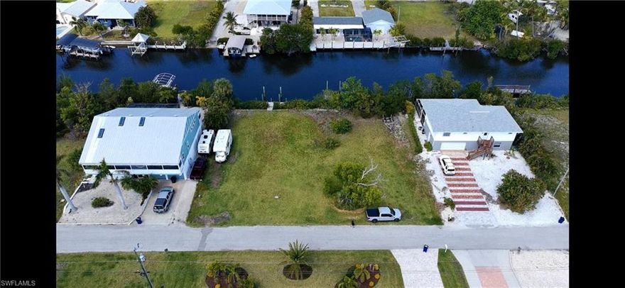 One of the last buildable lots in the sought after neighborhood of Serenity Cove in Bokeelia.  Come check out this 70' wide lot that is perfect for your dream home.  This lot already has a composite dock with post to tie up your boat.  With direct access to some of the best fishing and boating spots, including Sanibel, Cayo Costa, Captive, and Cabbage Key, you'll be just minutes away from exploring the beautiful waters without the hassle of navigating bridges.  
This location is also close to the Pine Island pool, pickleball and tennis courts, bike path, museums, marinas, and restaurants.  Don't miss this opportunity to own your piece of paradise!