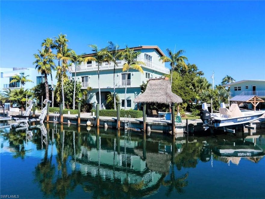 Welcome to this exceptional Port Antigua residence — a true boater’s paradise in the heart of Islamorada. Located on an expansive lot with over 135 feet of protected dockage, this 4BD/3.5BA home offers 3,520 SF of beautifully appointed living space and is designed for comfort, entertaining, and relaxed Keys living.

The open-concept layout welcomes you with natural light and coastal charm. Enjoy stunning bay views from the third-floor living area and a chef’s kitchen featuring high-end appliances, gas stove, custom cabinetry, and ample storage. The kitchen flows seamlessly into the dining and living areas—perfect for gatherings.

Boaters will love the two lifts, dual fish-cleaning stations, and easy access to the bay and ocean. After a day on the water, relax under your private tiki hut or unwind in the shaded outdoor spaces. A dedicated elevator connects all levels, and impact windows provide year-round protection. Additional features include a propane-powered backup generator, water softener, a 6-year-old roof, and two 1-year-old A/C units.

Located in the sought-after Port Antigua community, residents enjoy access to a private sandy beach, boat ramp, and tiki huts. Whether you're looking for a full-time home or island getaway, this property delivers the lifestyle you’ve always dreamed of.