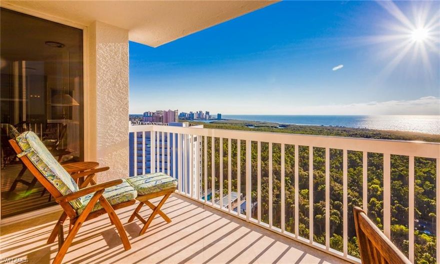 Awe inspiring, Naples and wide Gulf of Mexico views will delight from the 20th floor of St Marissa in desirable Pelican Bay. This stunning corner luxury beachfront condo with remodeled open concept kitchen boasts a pantry, granite counters, farm sink with instant hot water, double oven, built-in wine rack, and recessed lighting. Finishing touches include crown moulding, wainscoting while Plantation shutters adorn windows and sliders.  Onyx counters in remodeled master bath, tile showers, frameless glass doors, tub and recessed lighting. French doors lead to a glassed-in lanai where you can curl up with a good book. Custom built-in closet systems and marble floors throughout. Marvel at the gorgeous sunsets as you enjoy your favorite beverage or meal on the balcony. Relax or swim in the community pool or get in a workout in the fitness room. Walk along the mangrove-lined berm or take a tram to the private, pristine beach. Enjoy beachfront dining in any of the two restaurants. Kayaking, canoeing, fishing and sailing available too.