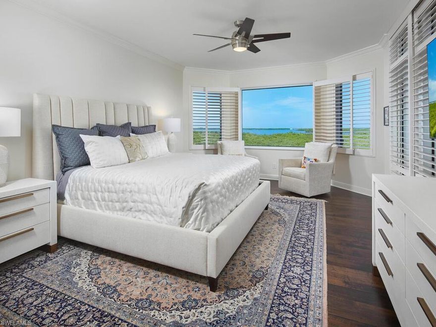 C12109 - Spectacular water views and dazzling sunsets! This 4th floor corner residence features 3 bedrooms with en suites + powder room, 2 abundant lanais, and is a thoughtfully designed great room floor plan allowing for seamless flow and an abundance of natural light throughout. The living room has a stunning bay view, offering a picturesque backdrop to everyday life and an expansive lanai bringing the natural beauty indoors. Enjoy entertaining guests in an updated kitchen with custom cabinetry, new quartz counter-tops, high end appliances including an induction cooktop. Primary suite presents breath-taking views, custom closet; luxurious master bath with dual vanities, tub, separate shower and marble detail. Each suite has private lanai access. Rich, gorgeous wood flooring as well as marble in the main areas, private elevator entry and electric storm shutters. 2 parking spaces. Enjoy Palermo secure high rise, maintenance-free living with 2 guest suites, social room, theater, board room, fitness center, pool & spa. The Colony offers pickle ball, bocce, tennis, canoe/kayak/sailing parks, 34-acre private island beach park and private waterfront dining at The Bay Club.