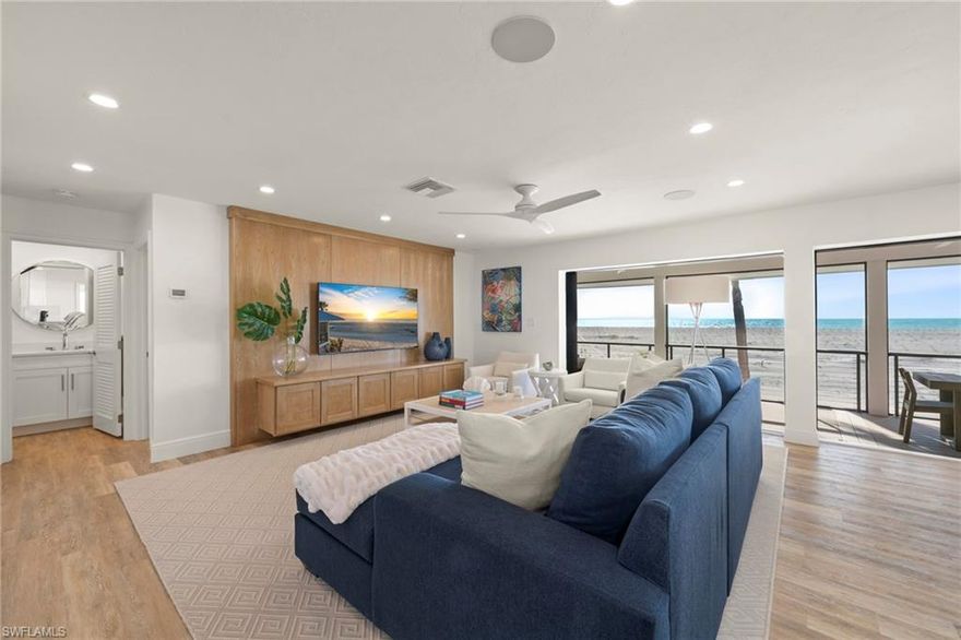 Offering a premier direct Gulf-front location, Beach Home 19 is an elevated 3 Bedroom + Den, 3 Bath residence positioned along one of Captiva’s most sought-after stretches of beach within the gates of South Seas. Thoughtfully redesigned and extensively renovated, this exceptional home blends modern coastal sophistication with the natural beauty of its beachfront setting. The open-concept interior features luxury vinyl flooring throughout, creating a seamless foundation for both durability and style. A custom floating staircase anchors the living space as a striking architectural focal point, enhancing light, volume, and visual flow. The beautifully appointed kitchen pairs form and function with custom wood cabinetry, substantial quartz countertops, premium stainless steel appliances, and a gas cooktop, true Gulf-front cooking with a view. Coastal-inspired furnishings and curated finishes create a relaxed yet refined atmosphere, allowing the Gulf to remain the focal point from nearly every room. Expansive impact-resistant windows invite abundant natural light while providing energy efficiency and peace of mind. Outdoor living is equally compelling, with composite decking designed for effortless enjoyment of sea breezes, sunsets, and direct access to the sugar-sand beach just steps away. Located within the gated South Seas community, Beach Home 19 offers privacy, exclusivity, and immediate access to some of the finest beaches in the United States. Whether envisioned as a private retreat or a luxury investment opportunity, this residence captures the essence of Gulf-front living on Captiva Island.