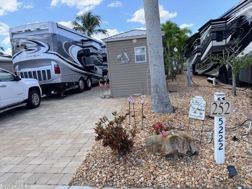 Take a drive onto this fully paved lake a lot and experienced the beauty of Sunset Lake where the fountain is directly in your front view as well as a beautiful common green area.  Make this your year-round permanent place or seasonal site in a South Florida RV Resort where the lot is fully deeded.  There are some additional assets to the lot including an amazing 10 x 24‘ tiki hut with twin ceiling fans, a four tiered paver brick block knee wall.  Included on your amazing lot pad is a super size L shaped “Paradise“ outdoor  kitchen which offers a beverage refrigerator, stainless steel cabinets for storage.  The stone counter top is 8’ x 38” and 8’ x 29 inch L shaped with a 30 inch paradise propane grill with a side burner.  Next to the outdoor kitchen is an Amazon 8 x 14‘ finished shed with twin side doors, a shower, toilet, very large sink and cabinets overhead. The shed is insulated and has a window air conditioner to help keep you cool.  There is plenty of landscaping on the lot  and is fully irrigated to water your song of India, cabbage palm, manila palm and moth orchids  This lot is competitively priced to sell quickly, please don’t wait too long and be disappointed.  Call for a private viewing.