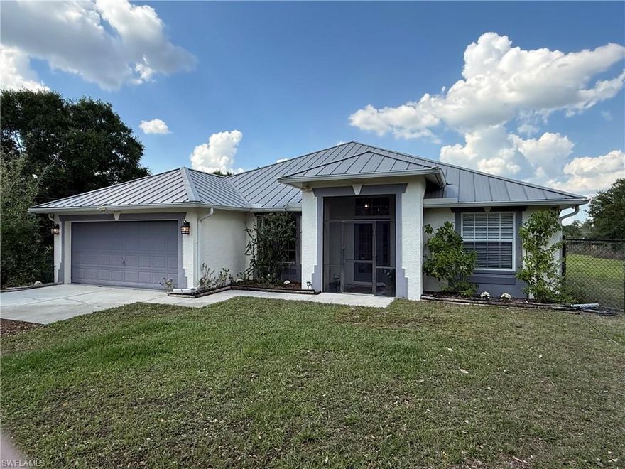 Enchanting 2.27 acre homesite in a natural rule location with a variety of beautiful trees. Quiet neighborhood. Close to Ave Maria, shopping and schools. 45 minutes from downtown Naples. Feel safe and healthy with children and pets, in this upgraded home with a metal roof, whole house, reverse osmosis, water, filtration system, new, upgraded electric panel, new AC, water heater, and large fenced in yards. Enjoy sunsets on the back of eye, swim and a 15 x 30 pool heated spa. Experience living with wildlife and beauty at its finest.