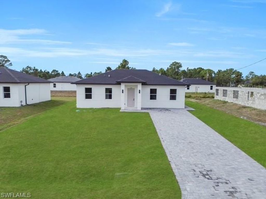 Photo of 708 PEACOCK AVE, LEHIGH ACRES, FL 33974 (MLS # 225082933)
