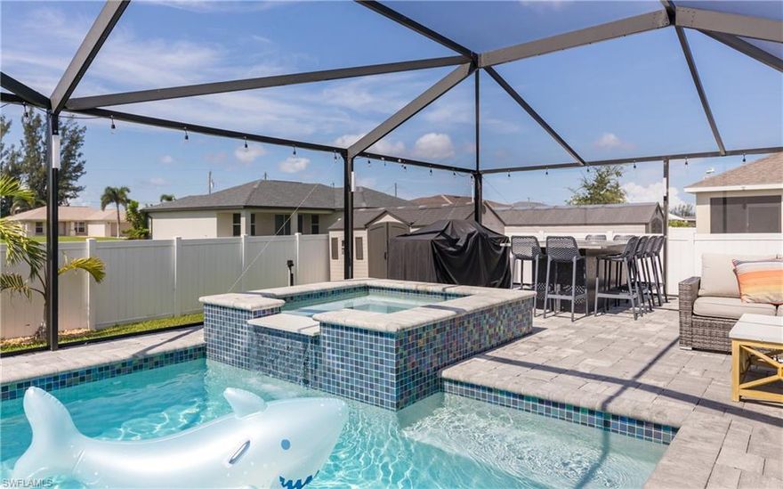 Cape Coral Charmer with a Pool, Spa & Shed Full of Possibilities! Welcome to your Florida dream home! This 3-bedroom + den, 2-bath beauty
has serious curb appeal, a fresh new 2023 shingle roof, and a whole lot of personality. Step inside to a bright, open floor plan with soaring
ceilings, granite countertops, and a kitchen that’s ready for everything from charcuterie night to pancake Sunday. The dining area flows
beautifully into the heart of the home, and the bonus DEN makes a perfect office, playroom, or glam room (you decide)! The primary suite is
spacious and serene with a spa-like ensuite featuring a soaking tub, double vanity, and a large walk-in shower. The guest bathroom opens
straight to the pool—because no one wants wet feet running through the house! Now, let’s talk about your "backyard oasis". The "custom pool
and spa" (added in 2019) are the stars of the show. Whether you're sunbathing with a mimosa or soaking under the stars, this lanai is built for
good vibes only. Grill, dine, watch the game, or just lounge—it’s all here, and it’s all screened-in for max comfort. Need storage or a creative
escape? There's a "shed out back" perfect for tools, toys, your secret hobby, or turning into the ultimate clubhouse—man cave, she-shed, or
kid’s kingdom. You name it. **Bonus Perks:** *New whole-house water softening system * Gorgeous tile throughout * Indoor laundry room *
Fully fenced yard for privacy * Attached 2-car garage with style Tucked away in a quiet Cape Coral neighborhood, this home is close to shops,
dining, schools, and all the sunshine-filled fun Southwest Florida is known for. So go ahead—dive in (literally). This home is ready for its next
adventure. Is it you??? Schedule your private tour today before it’s gone!