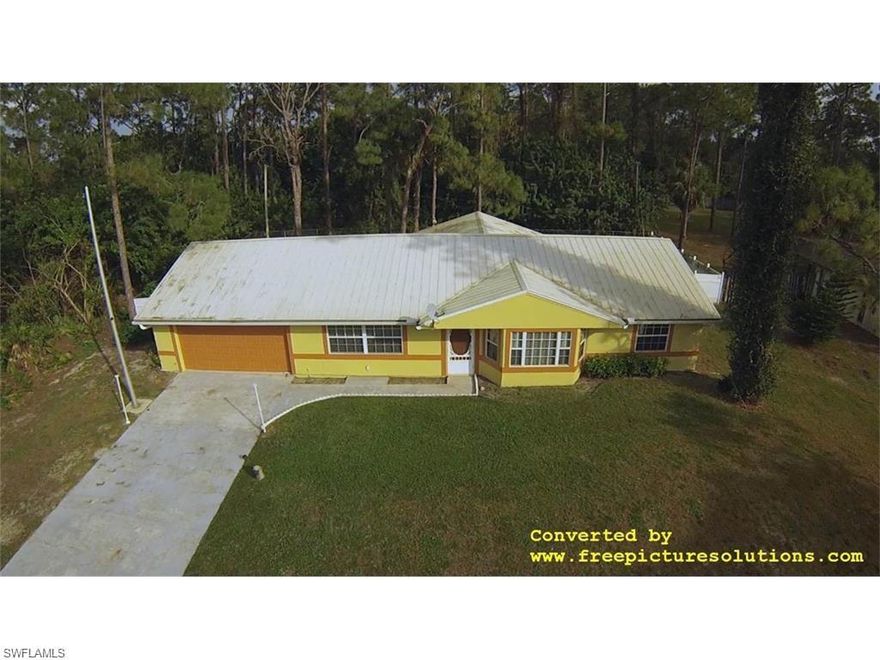 Beautiful 3 Bedroom two bath and 2 car garage Home that is is move in ready, in a highly desired area of Lehigh Acres. It has a large screened in Lanai with wall to wall Glass sliding doors and large windows that brings in plenty of natural light. The home Has Formal Dining, huge Family Room and a large master bedroom and is well Maintained.There are no deed restrictions or associations fees or rules. Close to shopping and all recreation, schools, hospitals and much more. Home has solid wood floors and is spacious with a fenced backyard with  modern metal Roofing and has a New Garage door. Financing available, call today for a private showing.