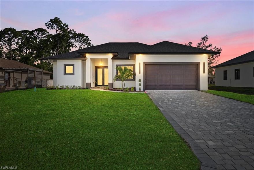 Discover this new construction home in Lehigh Acres offering modern design, quality finishes, and a highly desirable location just behind Lee Blvd with quick access to shopping, dining, schools, and major roads leading to Fort Myers. With no HOA and move-in ready construction, this home is ideal for buyers looking for space, convenience, and long-term value in one of Lehigh Acres’ fastest-growing areas.

This thoughtfully designed property features 3 bedrooms, 3 bathrooms, plus a versatile den, giving you the flexibility buyers are searching for—perfect for a home office, guest room, or additional living space. The open-concept layout is filled with natural light, creating a bright and welcoming atmosphere throughout the home.

The kitchen flows seamlessly into the main living and dining areas, making it perfect for both entertaining and everyday living. Upgraded details such as 8-foot solid wood interior doors add a level of quality and elegance that stands out in today’s new construction market.

The primary suite offers a comfortable retreat with a spacious bathroom featuring dual sinks and modern finishes, designed for both style and functionality.

Step outside and enjoy Florida living with a covered lanai and outdoor kitchen, perfect for entertaining, weekend grilling, or relaxing evenings at home. The home also includes a sprinkler system to help maintain a beautiful lawn year-round.

Conveniently located just minutes from Lee Blvd, this home provides easy access to shopping centers, restaurants, schools, and major routes connecting you to Fort Myers, making commuting simple while still enjoying the space and privacy Lehigh Acres offers.