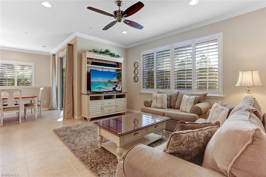 This IMMACULATE 2 bedroom 2 bath 2nd floor END UNIT is tastefully decorated in a soft natural color palette, and is being offered furnished. The open floor plan features incredible amount of natural light, raised paneled kitchen cabinets, under cabinet lighting, granite counters, crown molding, tile flooring in main living area, plush carpet in the bedrooms, custom plantation shutters, and a walk in closet in master suite! The corner screened lanai with comfortable breezes is a great entertaining space. Attached 1 car garage features an extra storage room for bikes and beach chairs. Community amenities include a large social room, a billiards room, heated resort pool with rock waterfall, a separate covered spa, and state of the art fitness center. This community is ideally located...across the street from the new LEE HEALTH FACILITY, a short drive to FGCU, Germain Arena, minutes to Coconut Point Mall with a variety of stores, restaurants, entertainment, and a movie theater, only 7 miles from the beautiful sandy beaches of Bonita Beach and Barefoot Beach, and a short 20 minute drive to the airport. A fantastic opportunity to own in Mirasol at Coconut Point...23421 ALAMANDA DR 203!