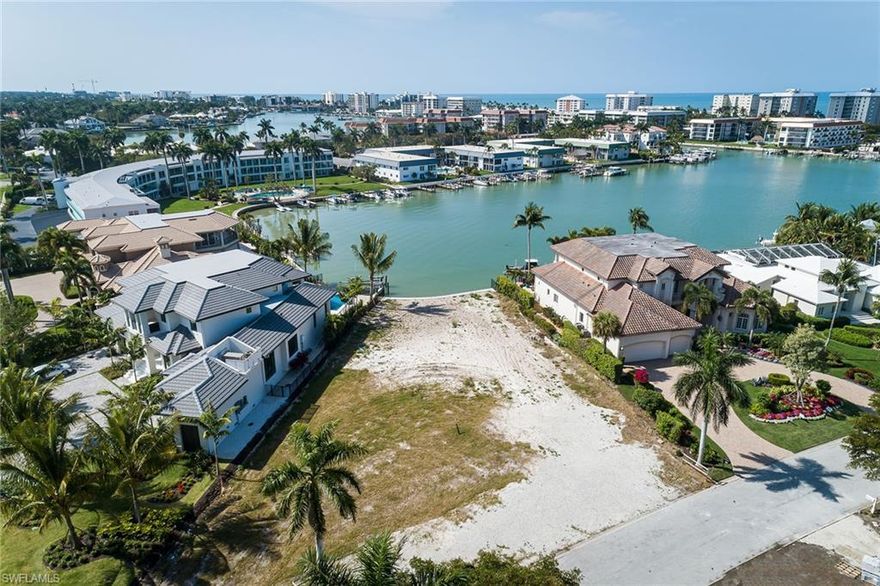 Welcome to one of the most coveted locations in all of Moorings. This highly sought-after southern exposure homesite enjoys long bay views. The deep corner lot makes this an ideal location to build a sun-filled luxury home with ample room for pool, spa and garage space. Enjoy a variety of water sports in this no-wake zone, with just one bridge to the gulf waters via Doctors Pass. You may explore optional memberships to Moorings Beach Park and The Moorings Country Club. Sea wall work done by Greg Orick. Survey is available.