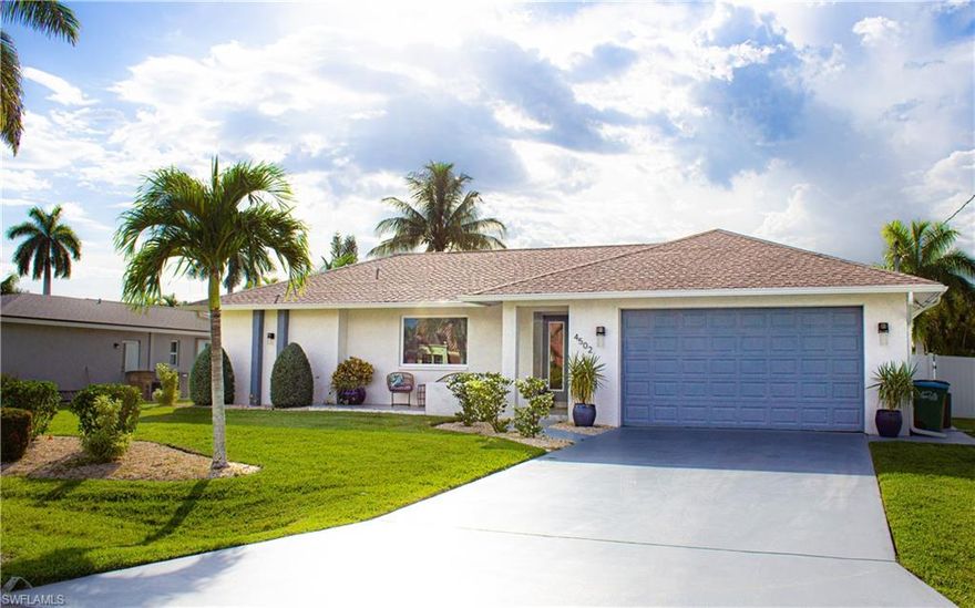 This beautiful home was completely renovated in 2020 and boasts a Million dollar view through it's front picture window! This home has two master ensuites, each with pool access. In addition, the third bathroom is accessible from the pool. Brand new pavers line one side of the pool cage leading to the perfect spot for a fire pit. The re-plastered pool and new tile in 2020, recent new pool pump and the western exposure provide an opportunity for a poolside sunset view. The renovation in 2020 brought the new open kitchen with shaker cabinets, granite, stainless steel appliances, luxury vinyl flooring and tile throughout the home. Also replaced was the AC, a complete re-pipe and sod with irrigation system. This a must see and won't last long. Nothing to do except move in!