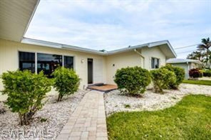 A Rare Waterfront Gem on the Rubicon Canal! Discover an exceptional opportunity with this 2-bed, 2-bath waterfront retreat on the expansive 200 ft wide Rubicon canal. Enjoy easy access to the Caloosahatchee River—only one bridge away and under a 15-minute journey by boat. This charming home combines traditional touches and modern updates, featuring a recently remodeled kitchen, impact windows, and beautiful original Terrazzo floors throughout.The property comes fully furnished and is move-in ready. Step into a bright and inviting living space with wide water views from almost every room. Outside, the screened lanai off the kitchen, complete with a barbecue grill, opens up to a large pool and a spacious paved terrace perfect for sunbathing, relaxation, and entertaining.Located conveniently near downtown Cape Coral, you’ll find parks, top-notch dining, and shopping just minutes away. With its inclusion in a vacation rental program, this property also makes for a fantastic investment or a 1031 exchange option. The buyer is asked to honor future reservations. New A/C installed three years ago. No flood damage from Hurricane Ian! Situated in the X500 flood zone. This waterfront retreat won’t last long—schedule your showing today!