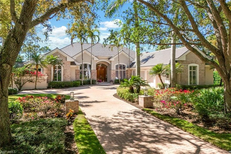 Situated on a south-facing 0.60-acre lot, this custom-built estate home offers 130 feet of golf course frontage with serene lake views over hole #15. Designed for single-story living, the home spans 4,100 square feet
under air, complemented by an oversized three-car garage. Enjoy over 3,200 square feet of outdoor space designed for relaxation and entertaining. The solar-heated, 33-ft. lap pool is surrounded by multiple sun-drenched deck areas and expansive under-roof seating and dining spaces. A fully equipped outdoor kitchen with a granite bar, BBQ, side burner, and smoker makes alfresco dining effortless. The home’s open, light-filled layout showcases high ceilings, tray accents, French doors, large picture windows, and zero-corner disappearing sliding glass doors for seamless indoor-outdoor flow. Marble flooring inside and out, custom millwork, and rich crown molding add to its timeless elegance. The chef’s kitchen is equipped with a 6-burner gas cooktop, Subzero refrigerator and two Subzero refrigerated drawers, double ovens, and a quartz-topped island. A butler’s pantry with a quartz-topped serving counter and undercounter wine cooler provides additional convenience. A climate-controlled wine cellar holds up to 750 bottles, perfect for the collector. The library is customized with wood flooring and full-wall custom wood built-ins. All bedroom suites have private baths and walk-in closets. The primary suite features wood flooring, a spacious sitting area, two large walk-in closets off the vestibule with morning bar, and a marble-clad bathroom with door to a privacy garden and gas-heated spa. Recent upgrades to the home include a 2024 new roof; impact-rated glass and storm shutters; and an insulated garage complete with hurricane-rated overhead doors and an Encore garage system utilizing premium floor coating, cabinets and organizers. Located in the prestigious Audubon Sanctuary Club of Collier's Reserve, this estate home offers an exceptional lifestyle with world-class golf, nature preserves, and premium amenities.