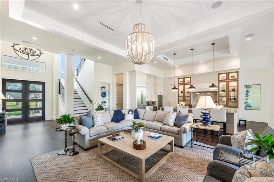 This 2020 carefully crafted dream home in Park Shore, Point West community is a rare offering on Parkview LN. The beautiful 2-level home is 5 bedrooms, all en-suite, one currently decorated as an office. The amazing outdoor living space with fire pit overlooking a rare Parkshore green space offers a serene quiet setting for your FL lifestyle. Walk into this home through beautifully crafted wood and glass front doors to a large open great room living area with custom kitchen island, range with gas cooktop, 2 ovens, wall microwave, and a large walk-in pantry. Journey upstairs on a grand staircase to 3 en-suite bedrooms, loft area, and wet bar. Don't forget to glance at the beautiful chandeliers throughout the home for a welcoming chic coastal feel. Home is equip with an elevator, and a hidden closet that only you will know it is there!  The outdoor living space also offers gas kitchen, dining, gas fireplace, pool/spa and remote bug screens. The 2 car garage has plenty of room for added storage and provides two entrances into the home. Vantage smart lighting system, complete surround sound with Sonos bar for easy listening music, and smart TV's are only some of the upgrades you'll enjoy. All Hurricane impact windows and doors. Point West community is a 16 home HOA, with a community pool and gathering place. The community is small, quaint and very friendly, offering weekly get togethers for cocktails, snacks and conversation. Residents of Park Shore are invited to join in on the fun at the private Park Shore Beach.  No Hurricane Ian damage and peace of mind when you lock and go. 725 Parkview LN is a must see in the Park Shore community.  Some furniture negotiable, with some exclusions, and some furniture can convey.  A must see home in the Park Shore area...