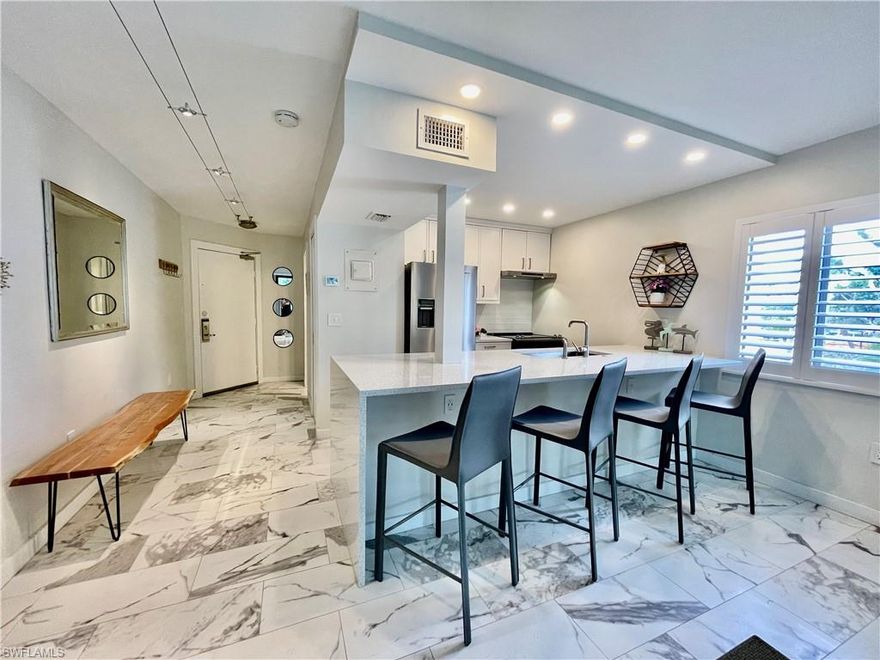 Magnificent 3210 Tennis Villas! Completely reconfigured, redesigned, and renovated. This turn-key, corner unit, 1 bedroom, 1 bathroom condo boasts only the finest detail integrated with an abundance of luxury located inside South Seas Island Resort. A floor-plan that has been redesigned to open the kitchen with just a small beam, extend the width of the island, expand the footprint of the bathroom/vanity area, and reconfigure the bedroom/closets. ONE OF A KIND! Offering a granite waterfall island, tile flooring throughout, stainless steel Whirlpool appliances, impact rated sliding glass doors, floor-to-ceiling tile walk in shower, hard-wood shaker doors, and coastal contemporary furnishings; this condo is truly hard to beat! Live the #IslandLifestyle inside the gates of South Seas Island Resort with proximity to Captiva’s white sandy beaches, the Village of Captiva, Retail Shops, Starbucks, and world-renown restaurants!