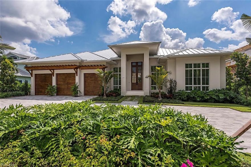 This newly constructed residence is an absolute all-star collaborative from developer Crayton Road Development, builder Knauf Koenig, and architect Falcon Design. This home affords an unrivaled combination of location, quality, and attention to detail. 5 bedroom residence offers just over 4,300 square feet of air conditioned space all on one level and is filled with top end finishes including wide plank Italian made wood flooring throughout, Cristallo Prime quartzite counter tops, Ruffino cabinetry, Sub-Zero/Wolf/Miele appliances, meticulously selected natural stones, Poliform closet systems, and an exceptional outdoor living area complete with kitchen, fire place, and automated screens/shutters. Truly a phenomenal home in an ideal location south of Mooring Line Drive offering easy access to Old Naples and the optional and exclusive private Moorings beach. Home completed construction October 2019.