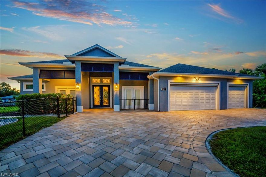 Built in 2019, this FULLY FURNISHED nearly new custom estate is a rare waterfront masterpiece offering the space, privacy, and luxury that are almost impossible to find. Situated on over 1.15 acres across five combined lots, including multiple oversized waterfront parcels and additional buildable lots across the street, this property delivers unmatched value, flexibility, and long-term potential. Set along 240 feet of pristine waterfront, the home features three docks, including one with a 10,000-lb boat lift and two additional docks ready for expansion. Inside, the residence showcases soaring 12-foot ceilings, dramatic custom wood entry doors, and expansive zero-corner sliders that open to sweeping water views and seamless indoor-outdoor living. The designer kitchen is a true showpiece, featuring a Sub-Zero refrigerator, premium appliances, elegant stone surfaces, and refined finishes throughout. The luxurious primary suite offers serene pool and water views, a spa-inspired bath with Roman shower and clawfoot soaking tub, and a custom California closet with direct access to the laundry room. Step outside to your private resort-style oasis—complete with a screened lanai, cedar plank ceilings, LED-lit heated saltwater pool, waterfalls, and a fully equipped stainless outdoor kitchen perfect for entertaining year-round. Additional highlights include a 3-car attached garage, a massive 40x40 detached garage with 16-foot ceilings and RV hookups, whole-house generator, electric hurricane shutters, and smart home features throughout. Located just minutes from dining, shopping, and Gulf beaches—with no flood damage, no storm impact, and no compromises—this is a rare opportunity to own a nearly new, estate-style waterfront home with unmatched land, privacy, and versatility.