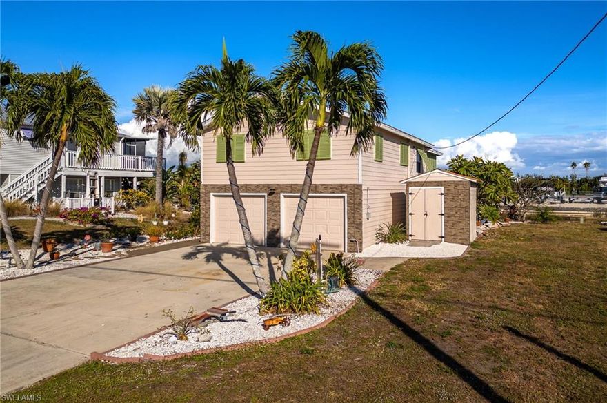 Welcome to your slice of paradise in Saint James City! This spacious two-story home offers a 2-bedroom main living level with a large, open great room, plus a full apartment downstairs—perfect for guests, multi-generational living, or rental income. Step outside to your private pool area, ideal for soaking up the Florida sunshine. This home has been thoughtfully updated with a new hot water heater, new pool pump, new AC system, new Hardie Board exterior siding, and hurricane impact windows and doors for peace of mind. Inside, you’ll find hardwood cabinets, tile flooring in the main living areas, and stainless steel appliances including a convection oven. Additional upgrades include elite insulated roof panels, abundant closet space, and a 2-car garage with an outdoor shed for extra storage. Perfect for those who love outdoor living, the property offers two 30-amp RV plugs, plenty of parking, and a boat lift rated for 7,500 lbs. Enjoy easy access to open water—ideal for boating, fishing, and exploring Pine Island Sound. This home is move-in ready and waiting for its next owner to enjoy the laid-back Saint James City lifestyle. Elevator/lift motor was just replaced. Don’t miss this opportunity!