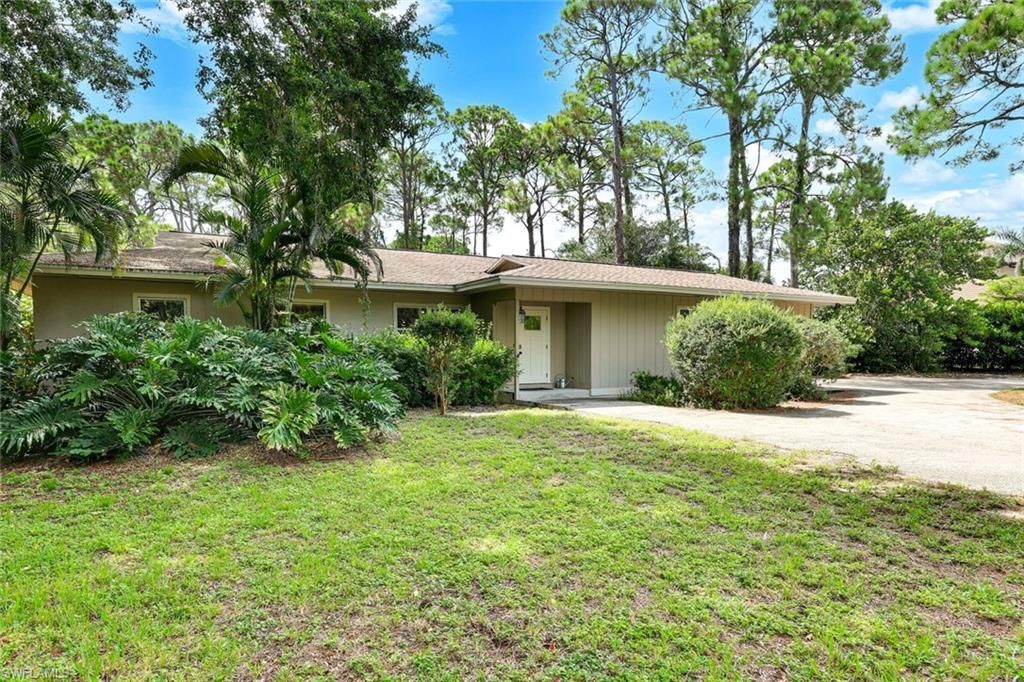 Photo of 131 Cajeput DR, NAPLES, FL 34108 (MLS # 225072363)