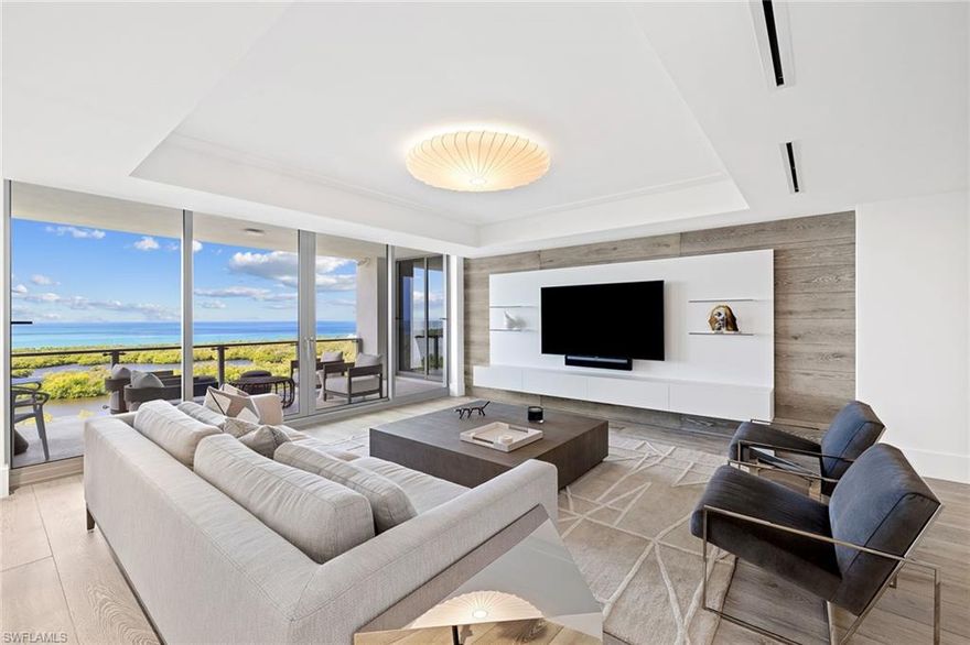 Impeccable residence in one of the newest and most well-appointed buildings in Pelican Bay. This western-exposure home boasts expansive views of the Gulf of Mexico, Clam Bay nature preserve and unparalleled sunsets. With floor-to-ceiling windows and wide-plank wood Legno Bastone wood flooring, this three-bedroom, three-and-a-half-bath en-suite condominium features custom shelving throughout, motorized shades in all rooms with Lutron technology and a stunning gas fireplace. Calcutta marble countertops accentuate the kitchen, which boasts Wolf, Sub-Zero and Miele appliances, in addition to a ceiling-height, glass-faced wine refrigerator. Mystique provides concierge services and a 24-hour staff that caters to a seamless lifestyle. Building amenities include pool/spa, social rooms, billiards, spa suites, a fully equipped board room, fitness, two tennis centers and a state-of-the-art theater. Guest suites are located on the lobby level for guests. Enjoy two exclusive Pelican Bay beach restaurants, available by tram, located just outside the building.